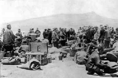 Passengers waiting at the Quarantine Station for disinfection with the Tiburon peninsula in the background.