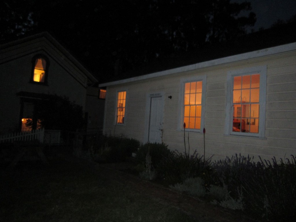 A glow from the windows of the Bake House welcomes the group as they head back to Camp Reynolds.