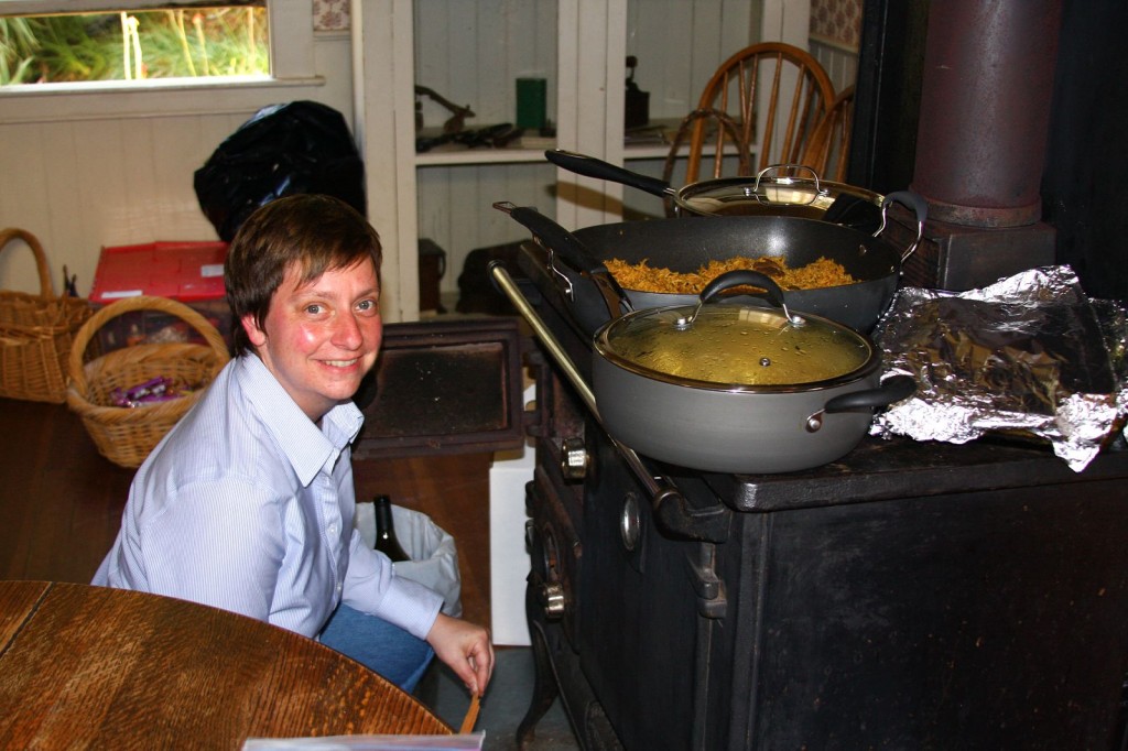 Joy Spicer "stoking" the warming stove.