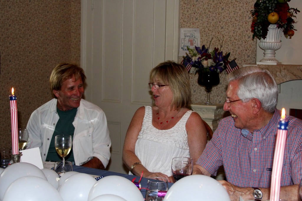 Doug McConnell, Aileen Howard and Edward Messerly chatting.