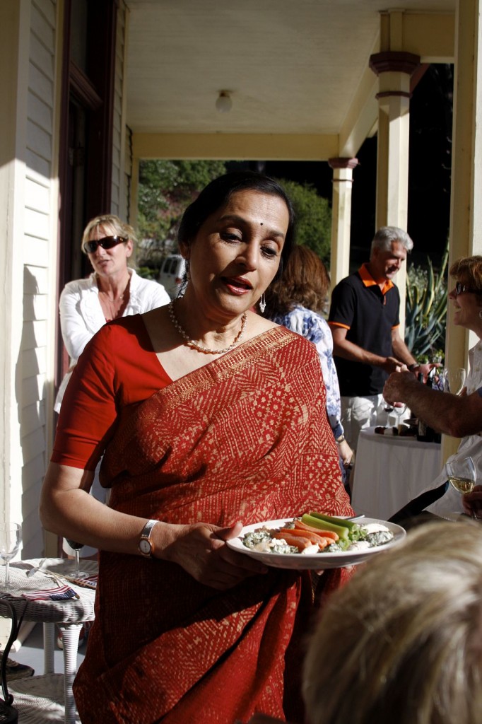 The event hostess, Sudha Pennathur, tending to guests.