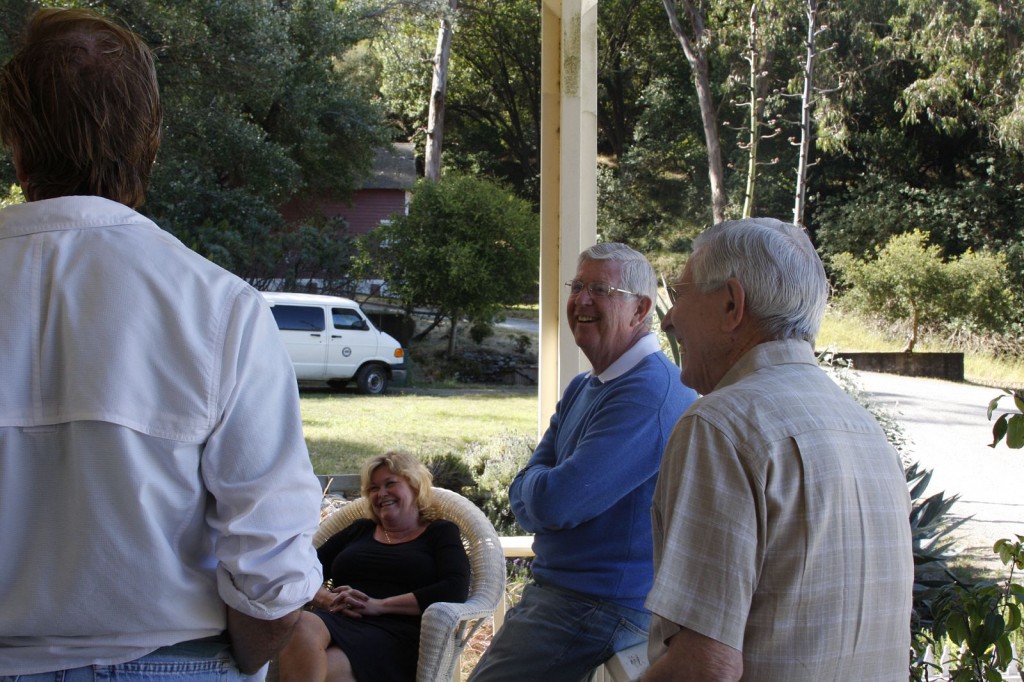 Doug McConnell, Peggy Duggan, Jim Shepherd. and Edward Messerly, cocktail hour on the porch of Quarters 10 - Camp Reynolds